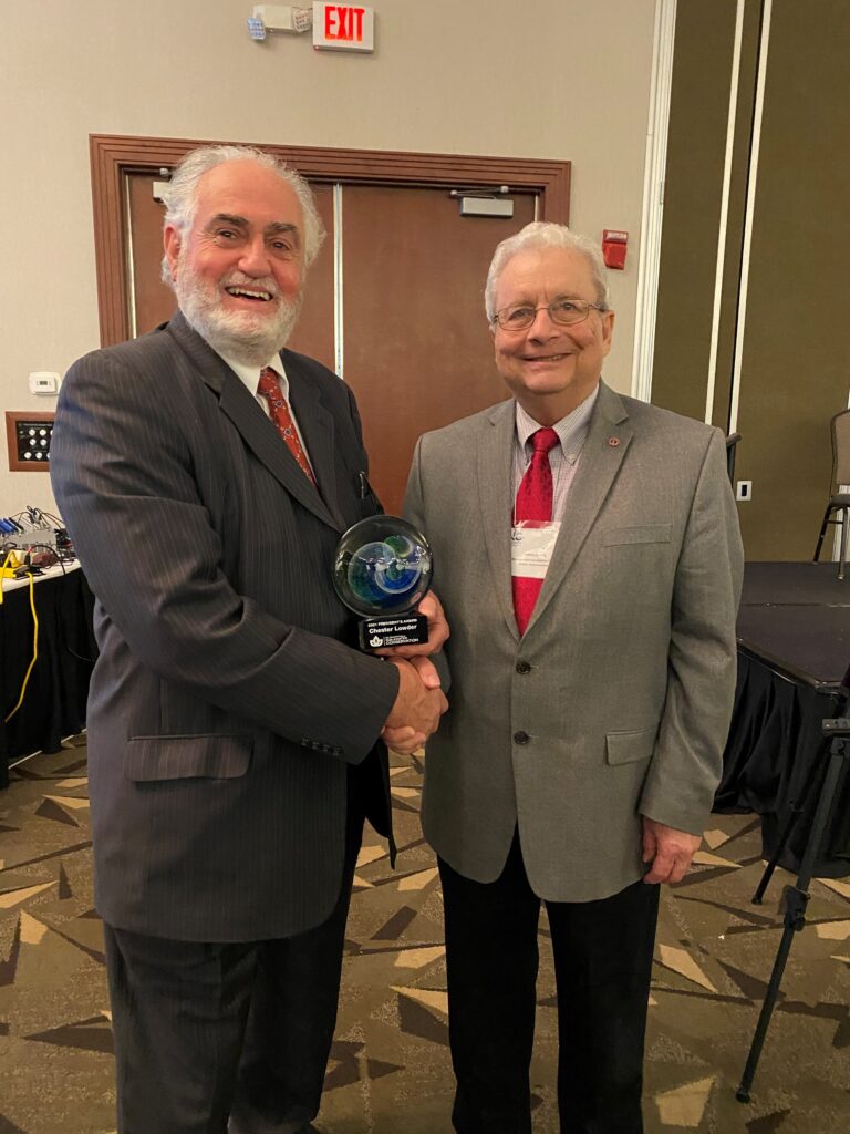 Chester Lowder (left) receives the 2021 NC Foundation for Soil and Water Conservation President's Award
